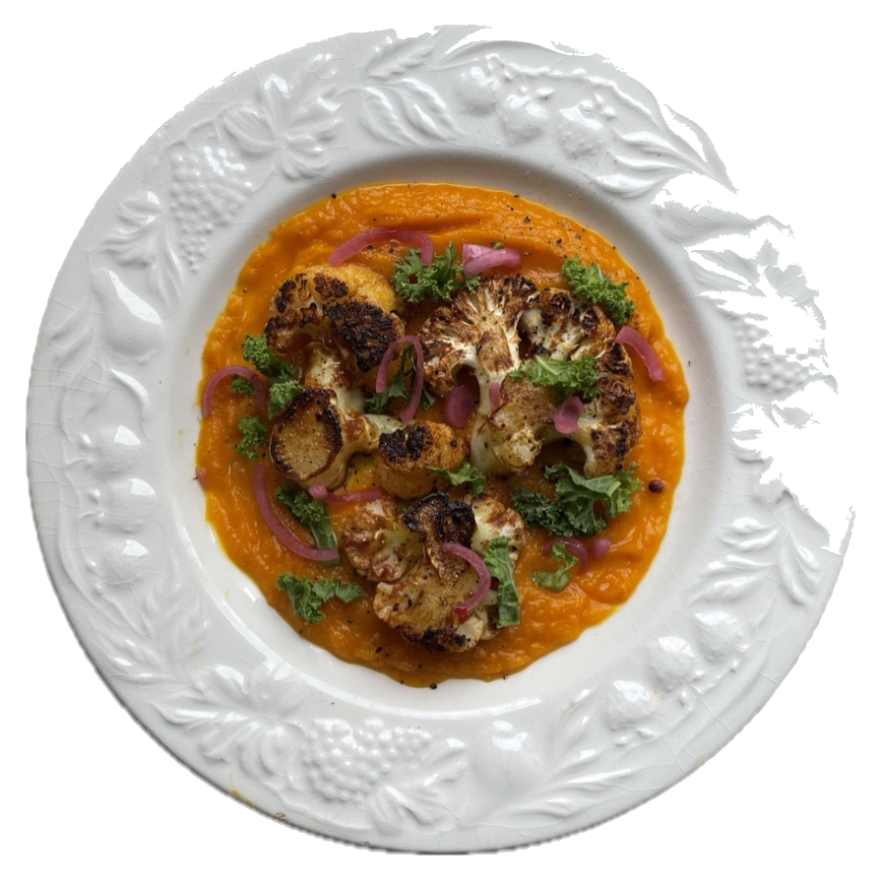 Roasted cauliflower on carrot purée, embossed white plate