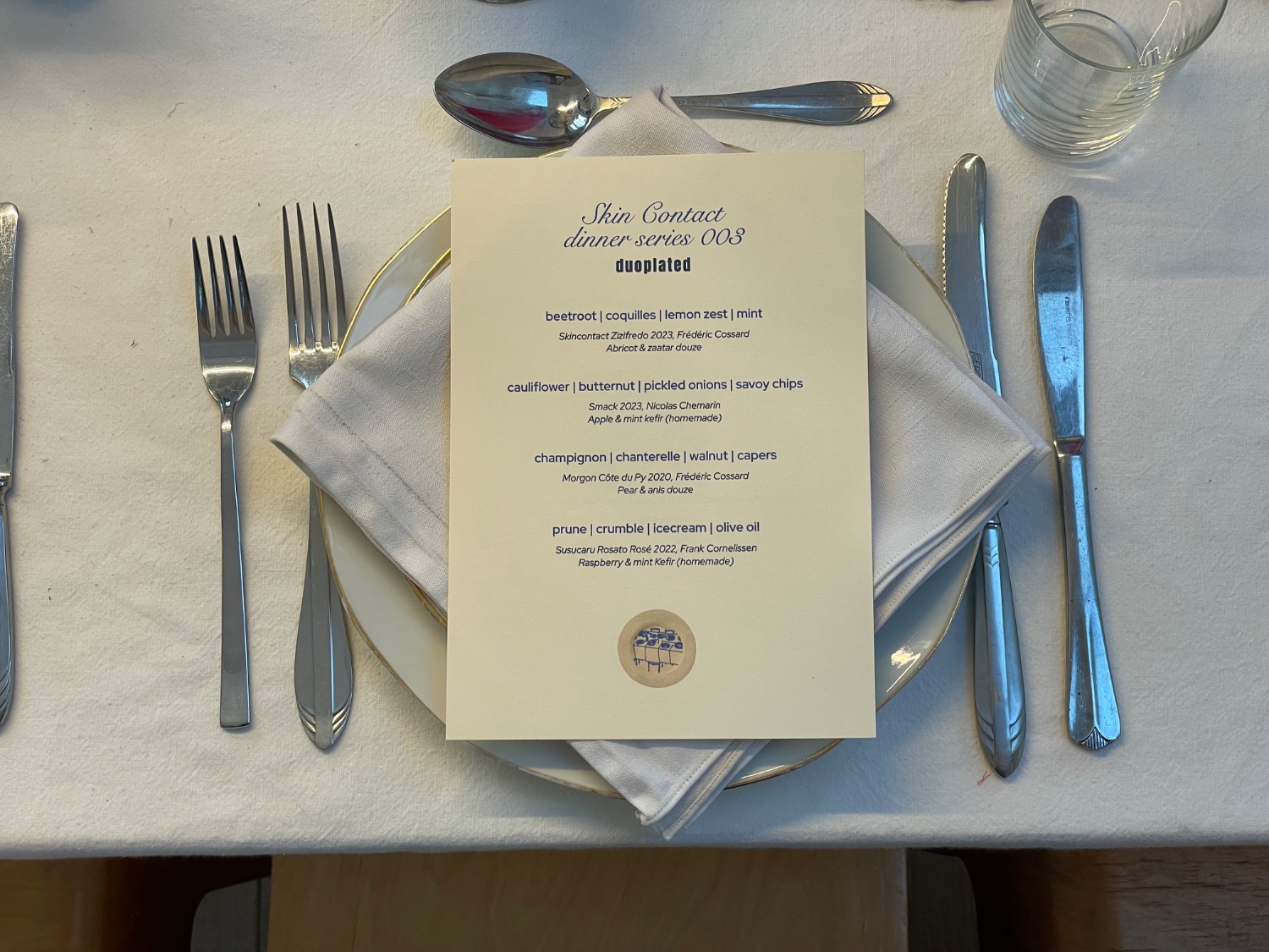 Skin Contact dinner series menu and place setting